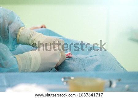 The hands of a surgeon.