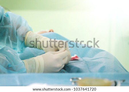 The hands of a surgeon.