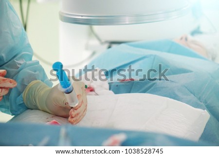 The hands of a surgeon.