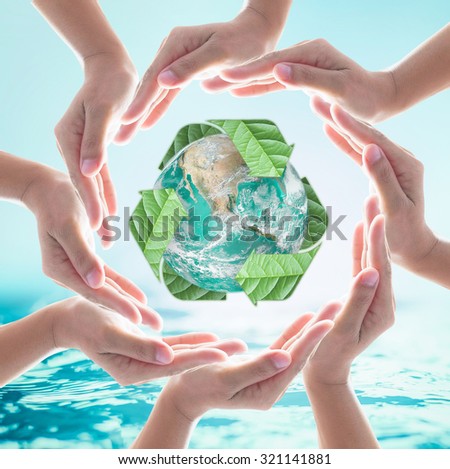 Hands surrounding green planet protected by recycle sign leaf on turquoise  blue water background. Elements of this image furnished by NASA