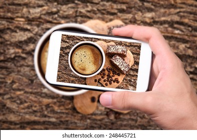 Hands Taking Photo Coffee Cup With Smartphone.