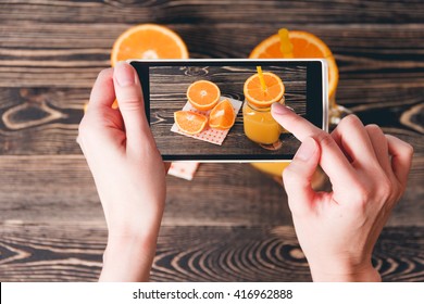 Hands Taking Photo of Oranges. Technology Concept - Powered by Shutterstock