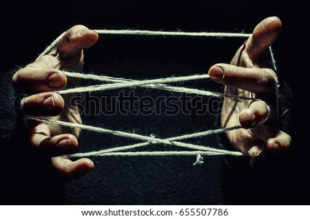 hands are tangled in the thread