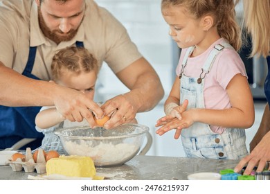 Hands, teaching or family cooking with children in kitchen for child development to prepare cookies. Father, parents or kids siblings learning recipe for bonding, baking or dessert for love in home - Powered by Shutterstock