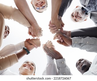 Hands, Teamwork And Motivation With A Business Team In A Huddle Or Circle Together From Below. Collaboration, Success And Community With A Man And Woman Employee Group Standing Hand In Hand In Unity