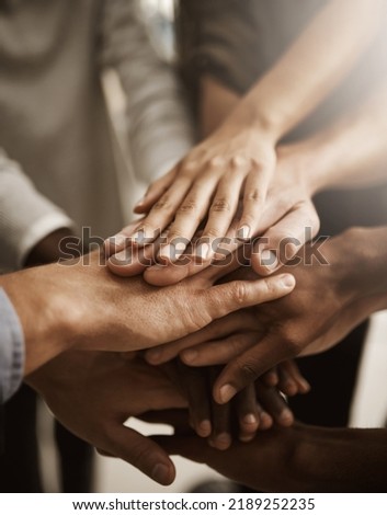 Hands, teamwork and support with a group or team of people showing togetherness, unity and solidarity in a gesture of working together, trust and collaboration. Closeup of cooperation and motivation