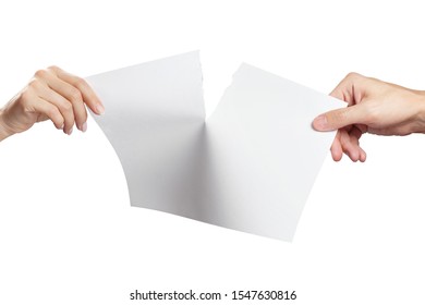 Hands tearing a sheet of white paper in half, isolated on white background