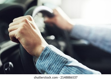 Hands At The Ten And Two Oclock Position. Closeup Shot Of A Man Driving A Car.