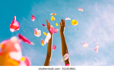 Hands throwing rose petals.  (Celebration concept) - Powered by Shutterstock