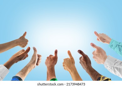 Hands with thumbs up. Concept of successful teamwork, or public social approval. Like thumb ok symbol, yes, okay, good, well, fine, nicely. - Shutterstock ID 2173948473