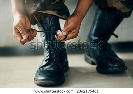 Hands tie shoes, closeup and soldier in army getting ready to start war, battle or fight. Boots, man tying laces in military and veteran preparing gear for training, exercise and workout to travel
