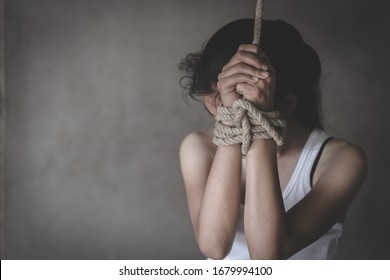 Hands tied up with rope of a missing kidnapped,  Victims of the human trafficking.  Abused and tortured concept. Stop violence against Women. International women's Day. Stop abusing violence.