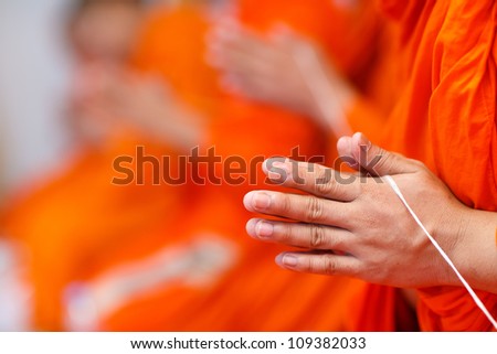 Hands together in salute , monks, Thailand