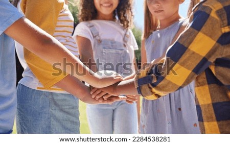 Hands together, support and children outdoor, solidarity and trust with motivation, games or growth. Closeup, kids or youth group with gesture for teamwork, commitment or fun with development or goal