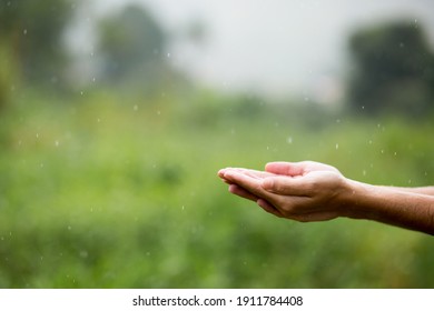 Hands together under raindrops. Washing hands in the rain. - Powered by Shutterstock