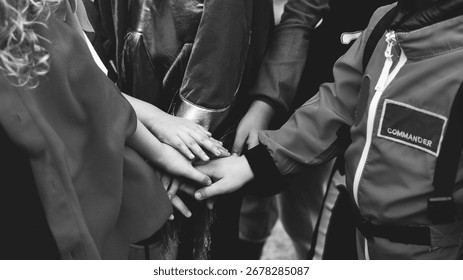 Hands together in unity, diverse group, teamwork. Unity, teamwork, diverse hands, together. Unity, teamwork, diverse hands. Group of multiracial people showing teamwork.