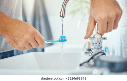 Hands, toothbrush and person at tap for water, dental hygiene and gum care at home. Closeup, brushing teeth and rinse oral product for fresh grooming, morning routine and cleaning at bathroom sink - Powered by Shutterstock