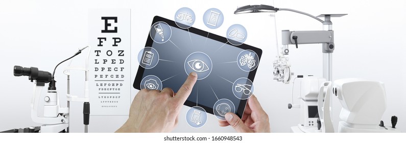 Hands Touch Screen Of Digital Tablet With Ophthalmologist And Optometrist Icons Symbols, Ophthalmology And Optometry Equipment On Background