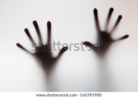 Hands touching frosted glass. Conceptual scream for help, depression, stress, panic