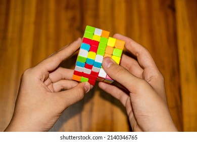 Hands Turning A Magic Cube