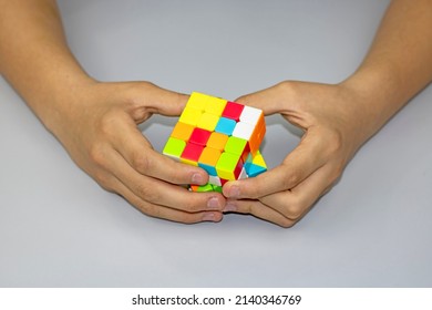 Hands Turning A Magic Cube