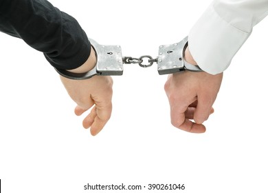 Hands Of Two Men Fixed In Handcuffs. Close Up. Isolated. Concept Of Accessory Of Crime.