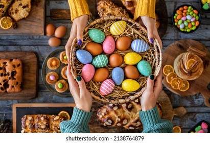 Hands of two women with Easter buns and Easter eggs. Paskalya coregi - Powered by Shutterstock