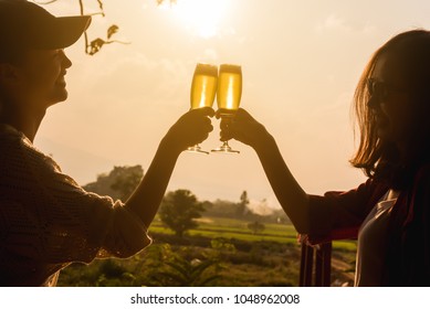 Hands Of Two Women Toast Champange Celebrating Under Afternoon Sunlight, Celebrating Occation