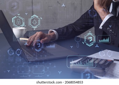 Hands typing the keyboard to create innovative software to change the world and provide a completely new service. Close up shot. Hologram tech graphs. Concept of Dev team. Formal wear.