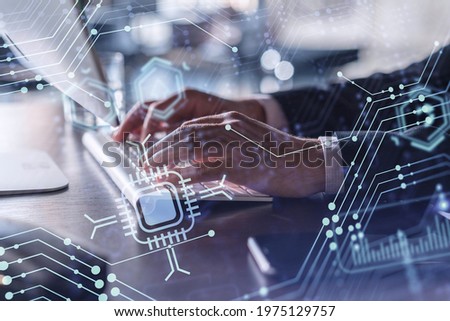 Hands typing the keyboard to create innovative software to change the world and provide a completely new service. Close up shot. Hologram tech graphs. Concept of Dev team. Formal wear.
