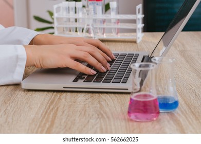 Hands typing in lab.