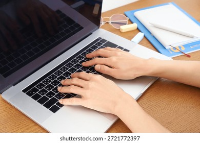 Hands typing on computer keyboard for business