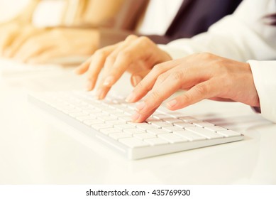 Hands Typing On Computer Keyboards