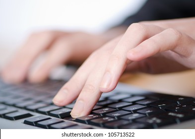 Hands Typing On The Keyboard