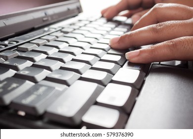 Hands Typing On Keyboard