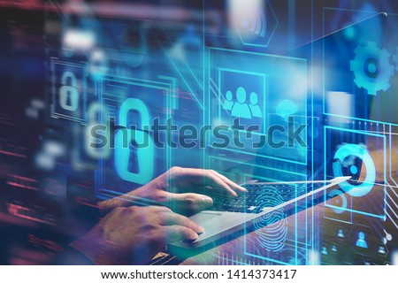 Hands typing on laptop computer at table with double exposure of online security virtual interface. Concept of data protection and blockchain. Toned image blurred