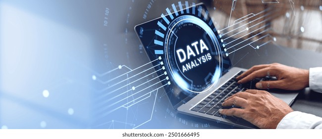 Hands typing on a laptop with a glowing Data Analysis text overlay. Digital graphic elements on a blurred background. Concept of data analysis in technology