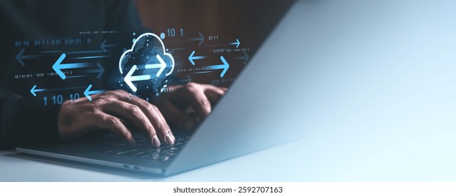 Hands typing on a laptop with glowing cloud and arrows representing data transfer on a blurred background. Concept of cloud storage and online network