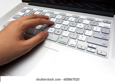 Hands typing on laptop keyboard close up - Shutterstock ID 600867020