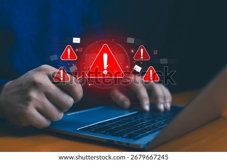 Hands typing on laptop with multiple red warning icons, concept of phishing attack, malware infection, email scam, cybersecurity threat, data breach, hacking risk, and online information protection.