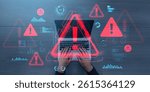 Hands typing on laptop surrounded by red digital warning symbols and data graphics, on a creative blue-toned background, concept of cybersecurity threats