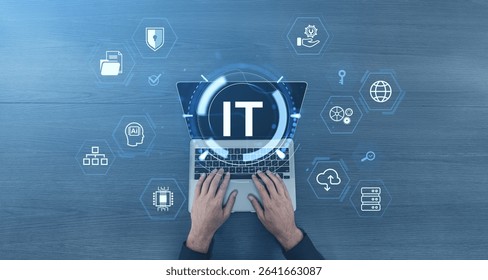 Hands typing on laptop with IT and tech-related icons in digital style on wooden background, concept of information technology and computing