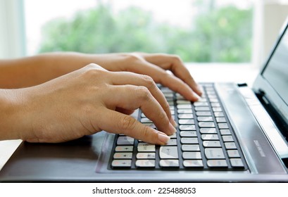 Hands Typing on Notebook PC
