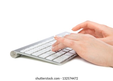 Hands Typing On The Remote Wireless Computer Keyboard In An Office At Workplace Isolated On A White Background