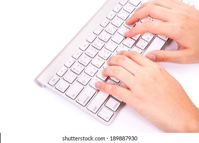 Hands Typing On The Remote Wireless Computer Keyboard In White Background