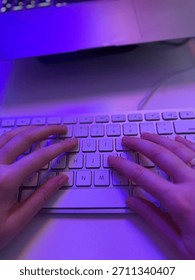 hands typing on a white keyboard central focus fingers on letter keys QWERTY layout top-down perspective bright soft lighting technology computer use work or study electronic device desk setup blurry 