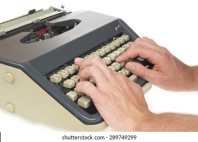 hands typing on writing machine