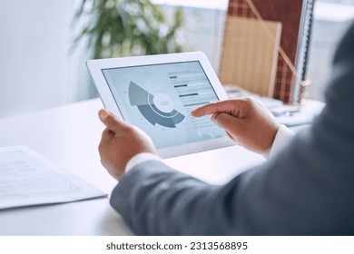 Hands typing, tablet and chart in office for social media marketing, stats or analysis on software. Man, touchscreen and graph for big data analytics, research or cloud computing with dashboard ux
