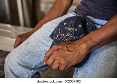 Hands of an undocumented worker from Central America in a soup kitchen in Sonora, Mexico, who is about to cross into the US without papers - Shutterstock ID 602089382