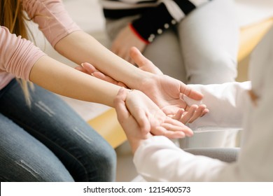Hands of unrecognisable child and a doctor ta pediatric check-up. - Shutterstock ID 1215400573